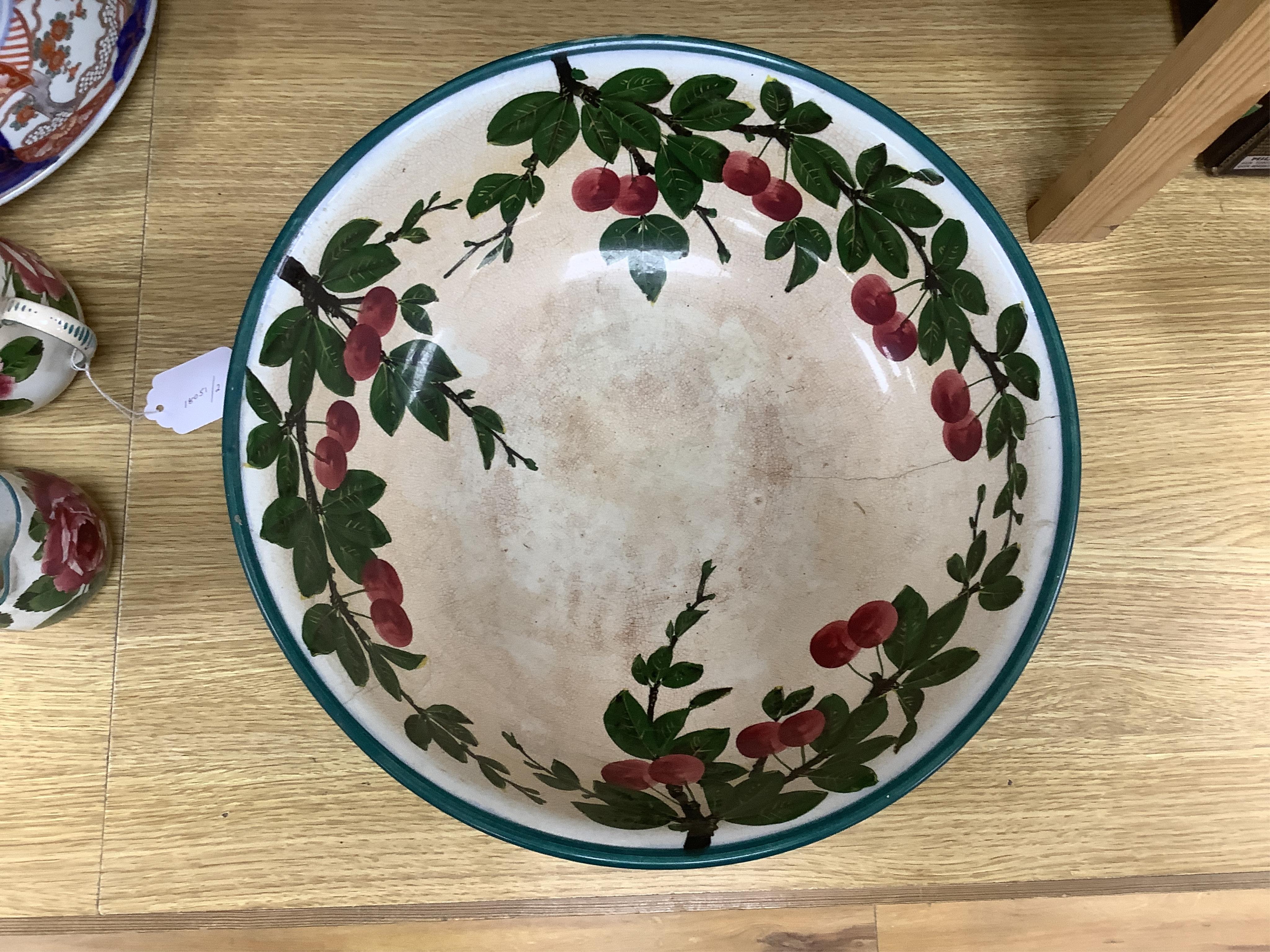 A Wemyss cherry branch decorated basin and two Wemyss jugs painted with cabbage roses, basin 38.5cm diameter. Condition- poor